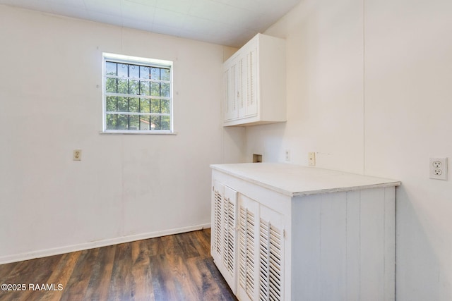 208 W Church St, Opelousas, LA 70570 - washroom featuring cabinet space, dark wood-type flooring, and washer hookup