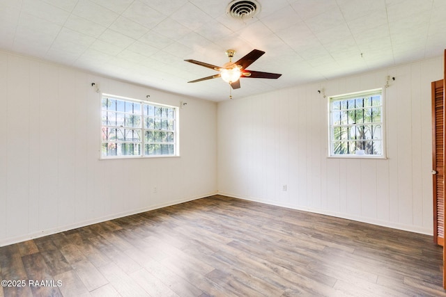 208 W Church St, Opelousas, LA 70570 - spare room featuring plenty of natural light, wood finished floors, and ceiling fan