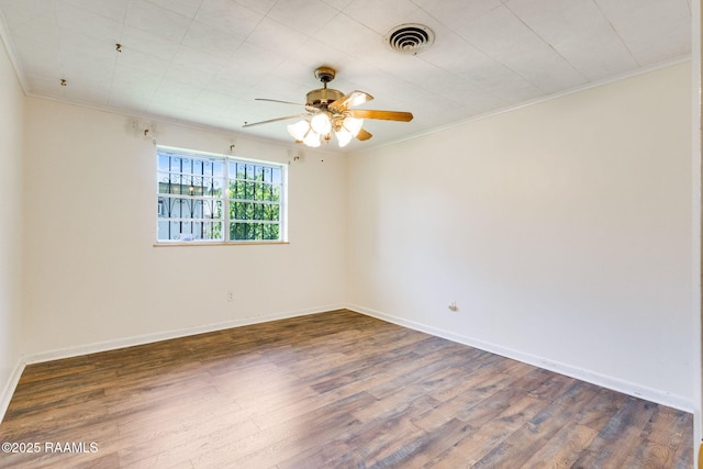 208 W Church St, Opelousas, LA 70570 - spare room with crown molding, wood finished floors, and ceiling fan