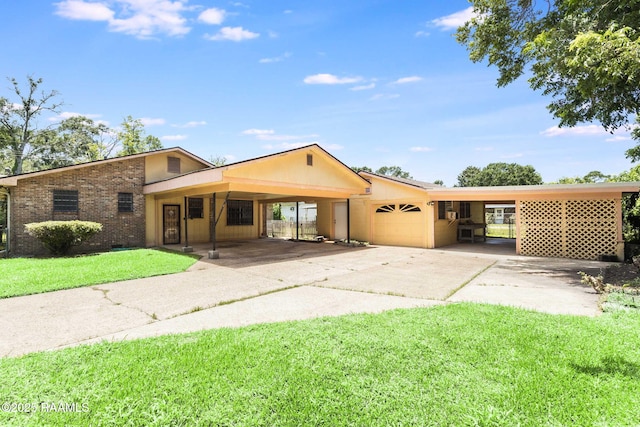 208 W Church St, Opelousas, LA 70570 - view of front of home with a carport, concrete driveway, a garage, a front yard, and brick siding