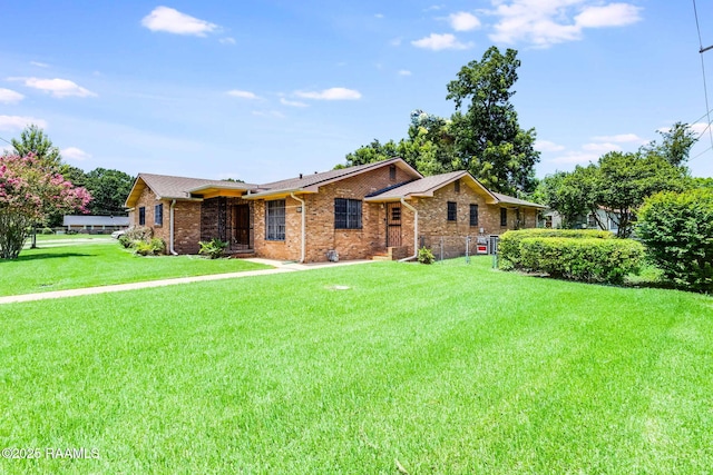 208 W Church St, Opelousas, LA 70570 - ranch-style house with a front yard and brick siding