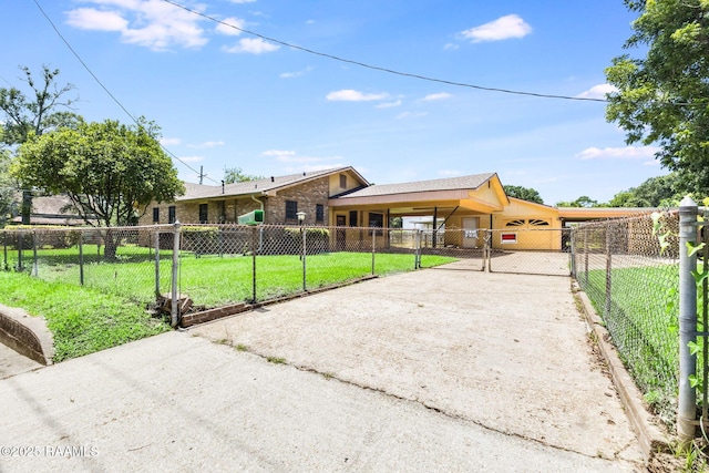 208 W Church St, Opelousas, LA 70570 - view of front of property with driveway, a fenced front yard, an attached carport, and a gate