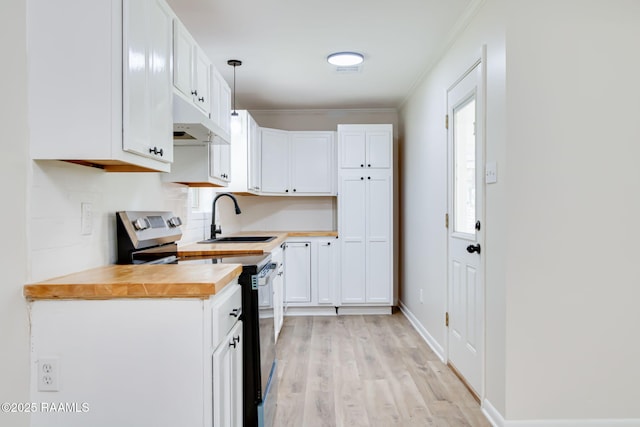 126 Lindsey Cir, Carencro, LA 70520 - kitchen with range with electric cooktop, wood counters, crown molding, under cabinet range hood, and white cabinetry