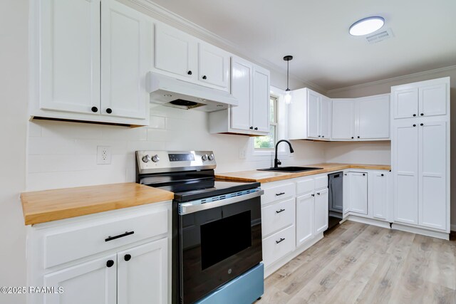 126 Lindsey Cir, Carencro, LA 70520 - kitchen with stainless steel electric range, under cabinet range hood, butcher block countertops, light wood finished floors, and white cabinets