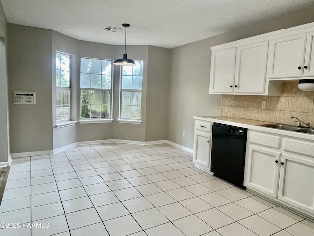 113 Earline Dr, Lafayette, LA 70506 - kitchen featuring dishwasher, backsplash, white cabinetry, light countertops, and pendant lighting