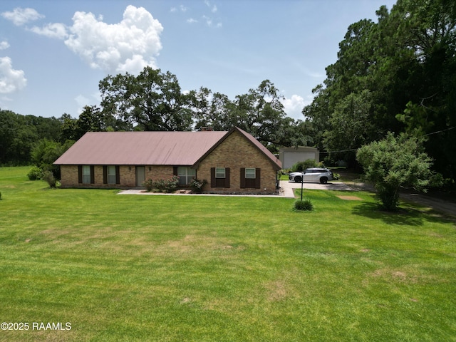 6516 Daspit Rd, New Iberia, LA 70563 - view of front of property featuring brick siding and a front yard