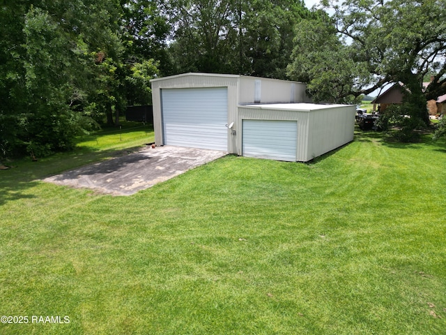 6516 Daspit Rd, New Iberia, LA 70563 - detached garage featuring view of wooded area