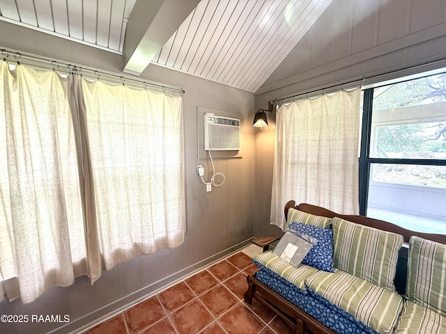 6516 Daspit Rd, New Iberia, LA 70563 - tiled living area featuring a wall mounted air conditioner and vaulted ceiling