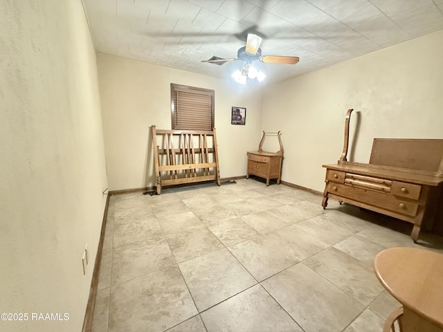 6516 Daspit Rd, New Iberia, LA 70563 - bedroom with light tile patterned flooring and a ceiling fan