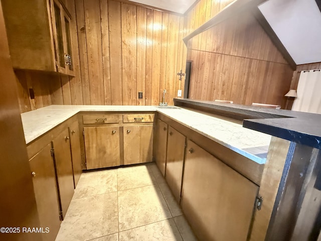 6516 Daspit Rd, New Iberia, LA 70563 - kitchen with wood walls, light countertops, and lofted ceiling