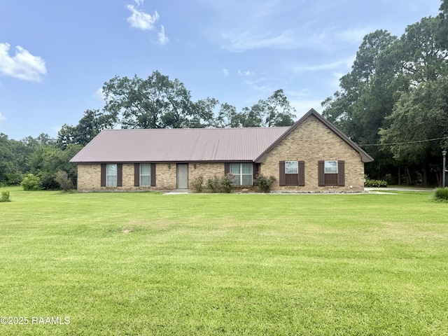 6516 Daspit Rd, New Iberia, LA 70563 - ranch-style home with a front yard, a metal roof, and brick siding