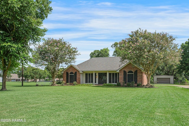 810 Fenetre Rd, Scott, LA 70583 - single story home featuring a detached garage, brick siding, and a front yard