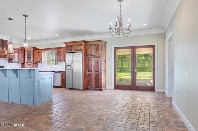 810 Fenetre Rd, Scott, LA 70583 - kitchen featuring stainless steel appliances, a kitchen breakfast bar, a chandelier, light countertops, and glass insert cabinets