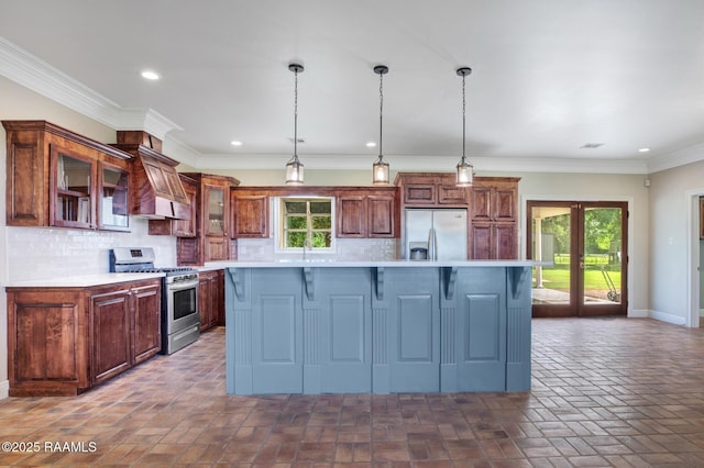810 Fenetre Rd, Scott, LA 70583 - kitchen with appliances with stainless steel finishes, light countertops, custom range hood, decorative backsplash, and glass insert cabinets