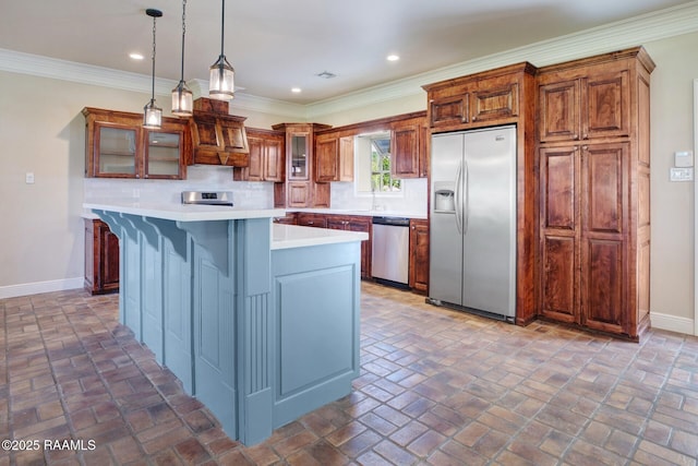 810 Fenetre Rd, Scott, LA 70583 - kitchen with stainless steel appliances, light countertops, a center island, brick flooring, and recessed lighting