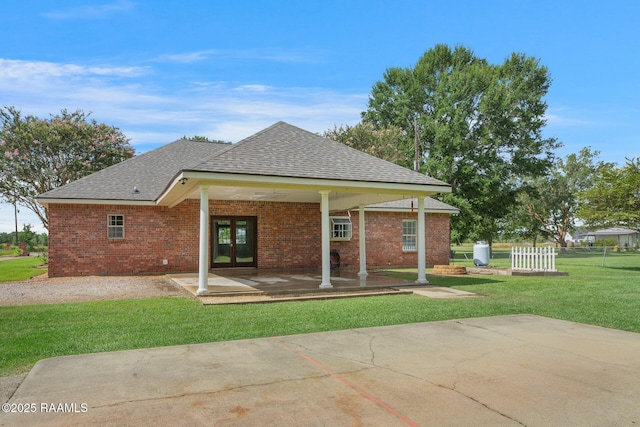 810 Fenetre Rd, Scott, LA 70583 - rear view of property featuring french doors, a lawn, a shingled roof, and brick siding