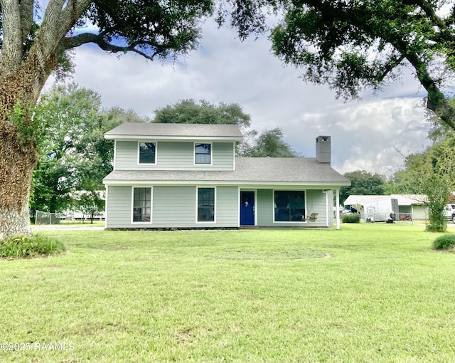 311 Fernway Ln, Duson, LA 70529 - view of front of property featuring a chimney, a front lawn, and roof with shingles