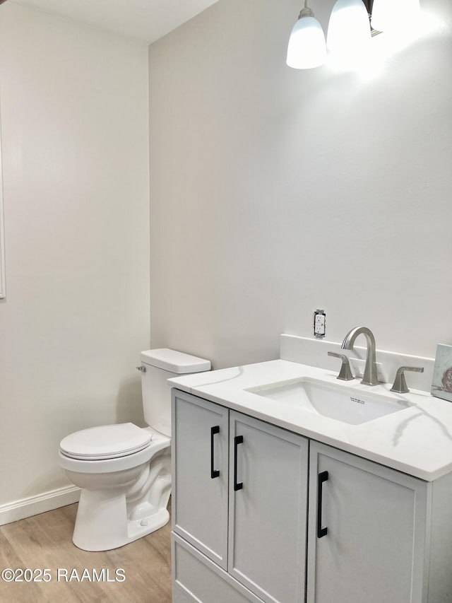 311 Fernway Ln, Duson, LA 70529 - half bathroom featuring vanity and wood finished floors