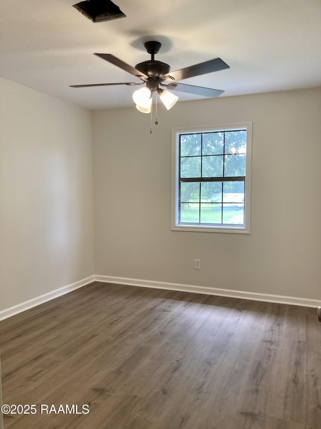 311 Fernway Ln, Duson, LA 70529 - empty room with a ceiling fan and dark wood-type flooring