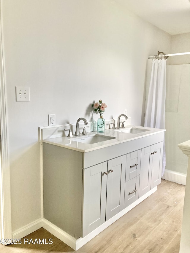 311 Fernway Ln, Duson, LA 70529 - full bath with a shower with curtain, wood finished floors, and double vanity