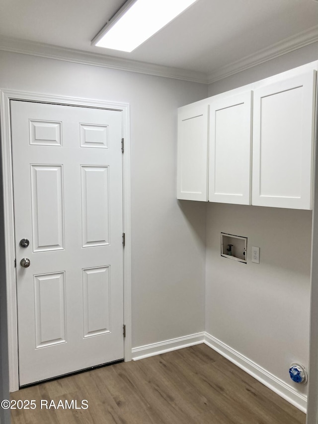 311 Fernway Ln, Duson, LA 70529 - washroom with cabinet space, dark wood finished floors, hookup for a washing machine, and ornamental molding