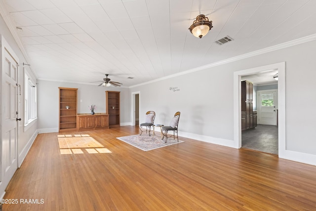 124 Taylor St, New Iberia, LA 70560 - unfurnished living room with light wood-style floors, ceiling fan, and ornamental molding