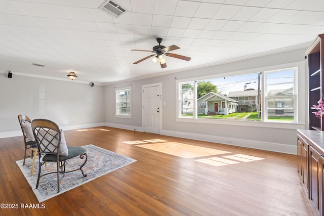 124 Taylor St, New Iberia, LA 70560 - foyer with light wood finished floors, ornamental molding, and a ceiling fan