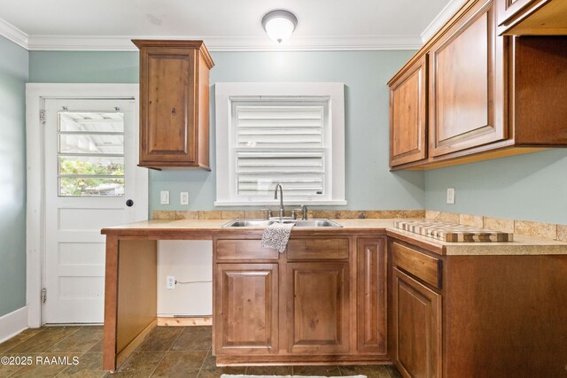 124 Taylor St, New Iberia, LA 70560 - kitchen featuring cooktop, brown cabinets, crown molding, and light countertops