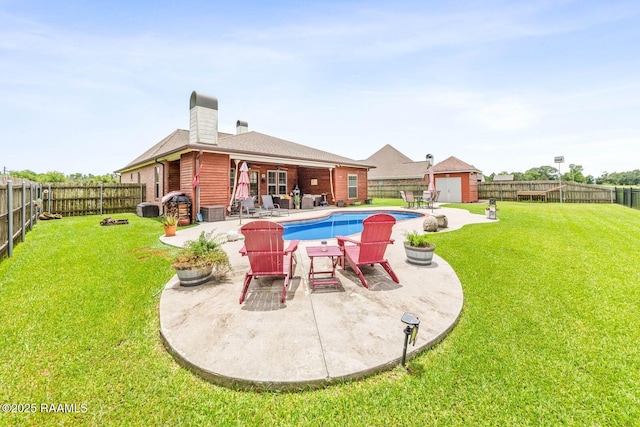 1181 Grand Loop, Breaux Bridge, LA 70517 - view of pool featuring a fenced backyard, a patio area, and a storage shed