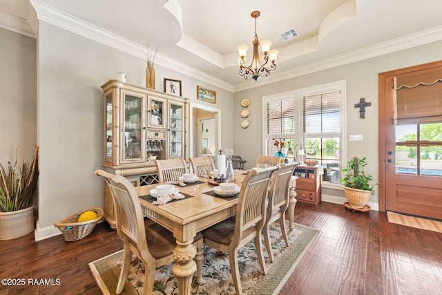 1181 Grand Loop, Breaux Bridge, LA 70517 - dining area with a chandelier, dark wood-style floors, ornamental molding, and a tray ceiling