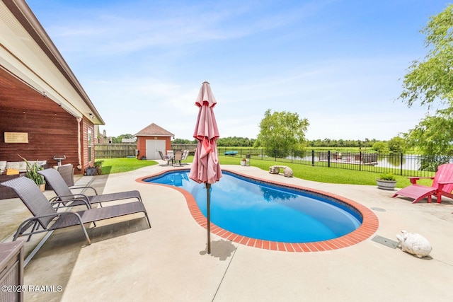 1181 Grand Loop, Breaux Bridge, LA 70517 - view of pool featuring a patio area, a fenced backyard, a water view, and a storage shed
