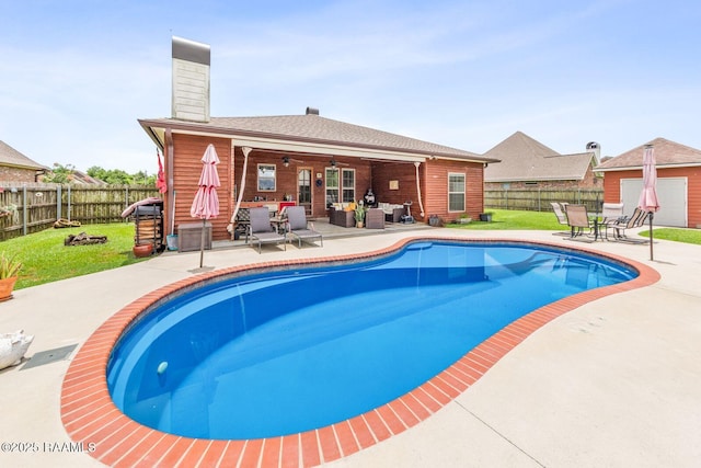 1181 Grand Loop, Breaux Bridge, LA 70517 - view of pool featuring a ceiling fan, a fenced backyard, an outdoor living space, and a patio area