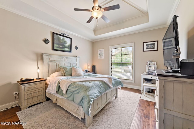 1181 Grand Loop, Breaux Bridge, LA 70517 - bedroom featuring a raised ceiling, wood finished floors, an office area, ornamental molding, and a ceiling fan