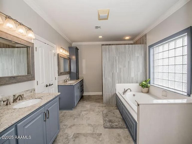 7421 W Congress St, Duson, LA 70529 - bathroom featuring two vanities, crown molding, and a garden tub