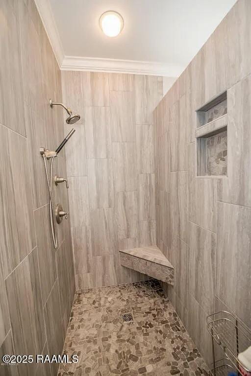 7421 W Congress St, Duson, LA 70529 - full bathroom featuring tiled shower and crown molding