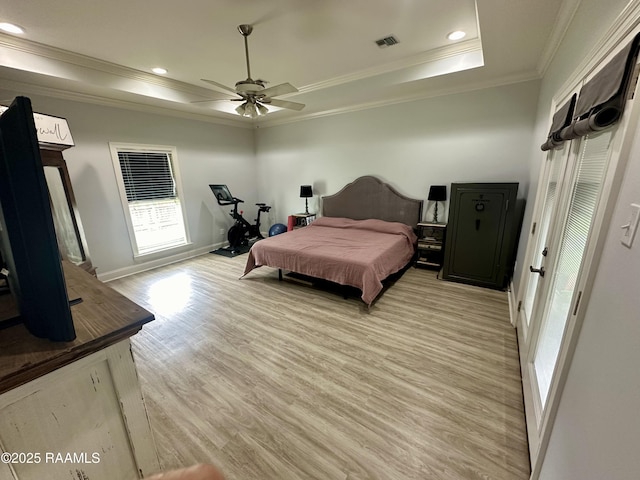 7421 W Congress St, Duson, LA 70529 - bedroom with crown molding, light wood-style floors, a tray ceiling, recessed lighting, and ceiling fan