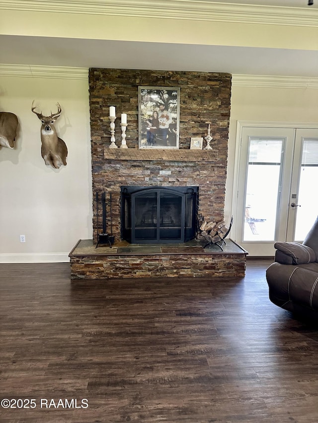 7421 W Congress St, Duson, LA 70529 - living area featuring a stone fireplace, wood finished floors, ornamental molding, and french doors