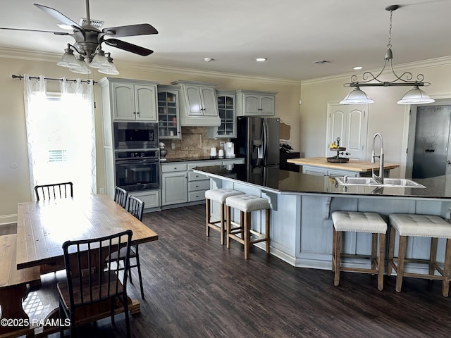 7421 W Congress St, Duson, LA 70529 - kitchen with black appliances, a ceiling fan, dark countertops, ornamental molding, and glass insert cabinets