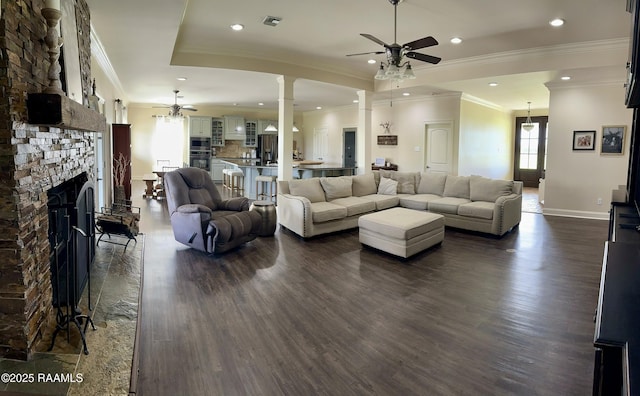 7421 W Congress St, Duson, LA 70529 - living room with ceiling fan, dark wood-style floors, ornamental molding, recessed lighting, and ornate columns