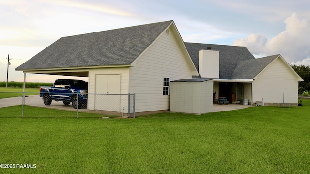 7421 W Congress St, Duson, LA 70529 - view of side of property featuring a chimney, a shingled roof, and driveway