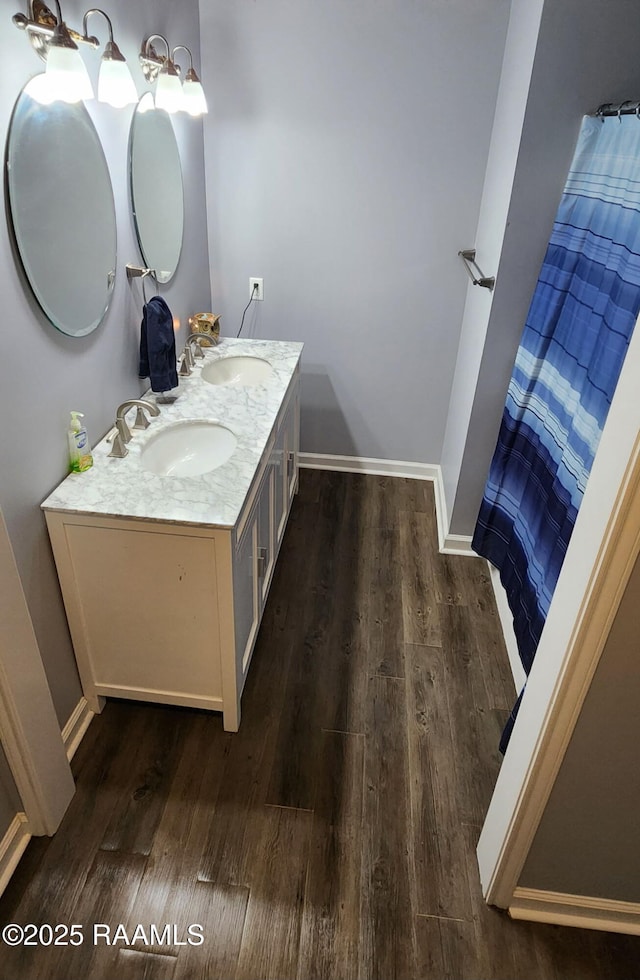 217 Marie St, Scott, LA 70583 - bathroom with wood finished floors and double vanity