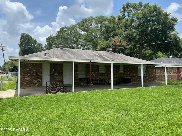 217 Marie St, Scott, LA 70583 - back of property featuring a patio area and brick siding