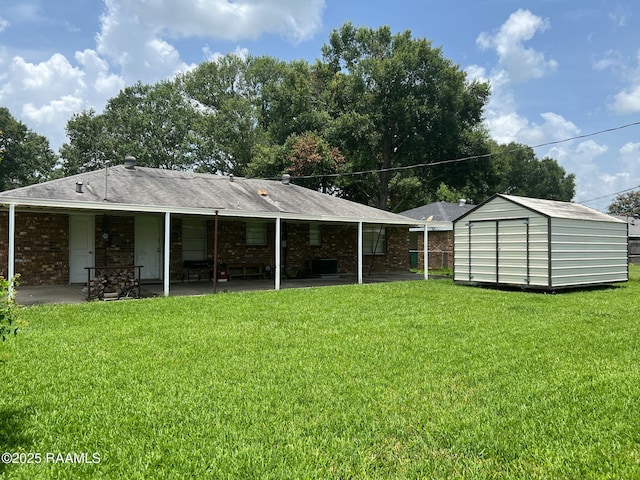 217 Marie St, Scott, LA 70583 - rear view of property featuring a patio, a shed, a lawn, and brick siding