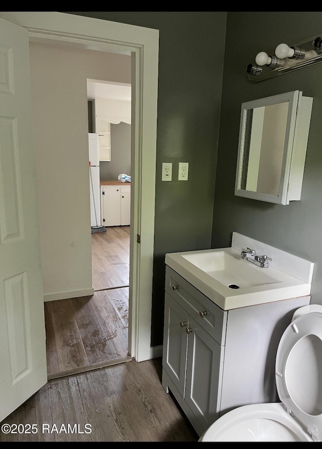 1136 Tupelo St, New Iberia, LA 70560 - bathroom with wood finished floors and vanity