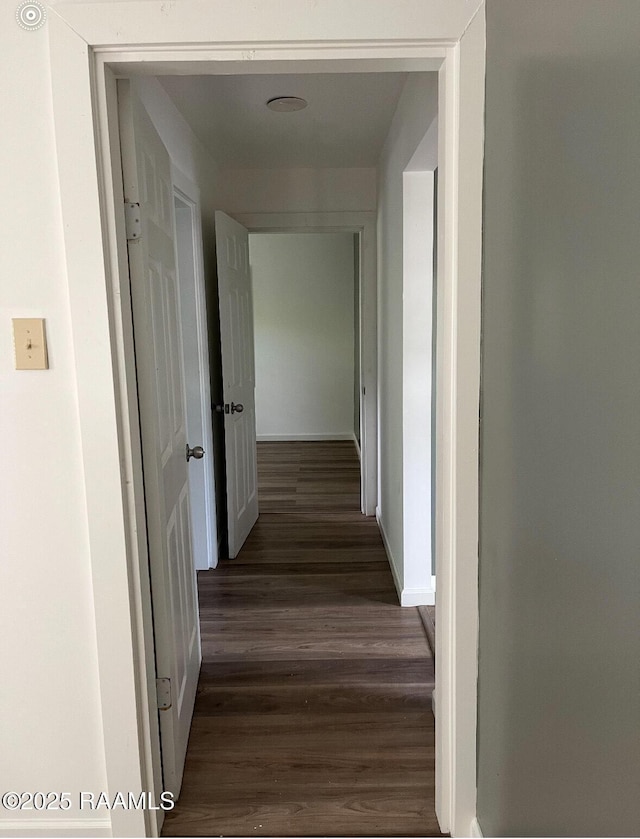 1136 Tupelo St, New Iberia, LA 70560 - hall featuring dark wood finished floors and baseboards