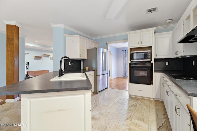1034 Hollow Oaks Rd, Breaux Bridge, LA 70517 - kitchen featuring black appliances, dark countertops, a peninsula, ornamental molding, and wall chimney exhaust hood