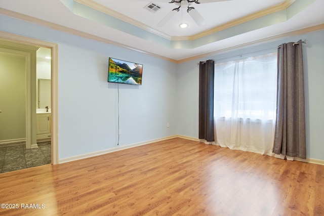 1034 Hollow Oaks Rd, Breaux Bridge, LA 70517 - unfurnished room with a raised ceiling, ornamental molding, light wood-style flooring, and ceiling fan
