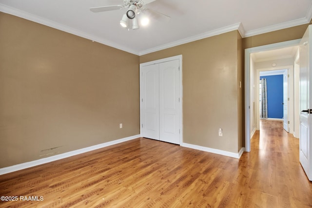 1034 Hollow Oaks Rd, Breaux Bridge, LA 70517 - unfurnished bedroom featuring light wood finished floors, a closet, ornamental molding, and ceiling fan