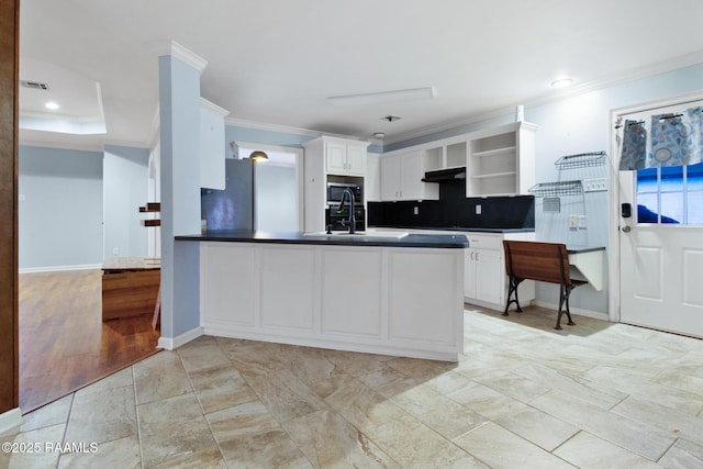 1034 Hollow Oaks Rd, Breaux Bridge, LA 70517 - kitchen featuring open shelves, ornamental molding, stainless steel appliances, a peninsula, and decorative backsplash