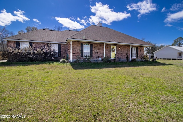 1034 Hollow Oaks Rd, Breaux Bridge, LA 70517 - view of front of property featuring brick siding, a front lawn, and a chimney